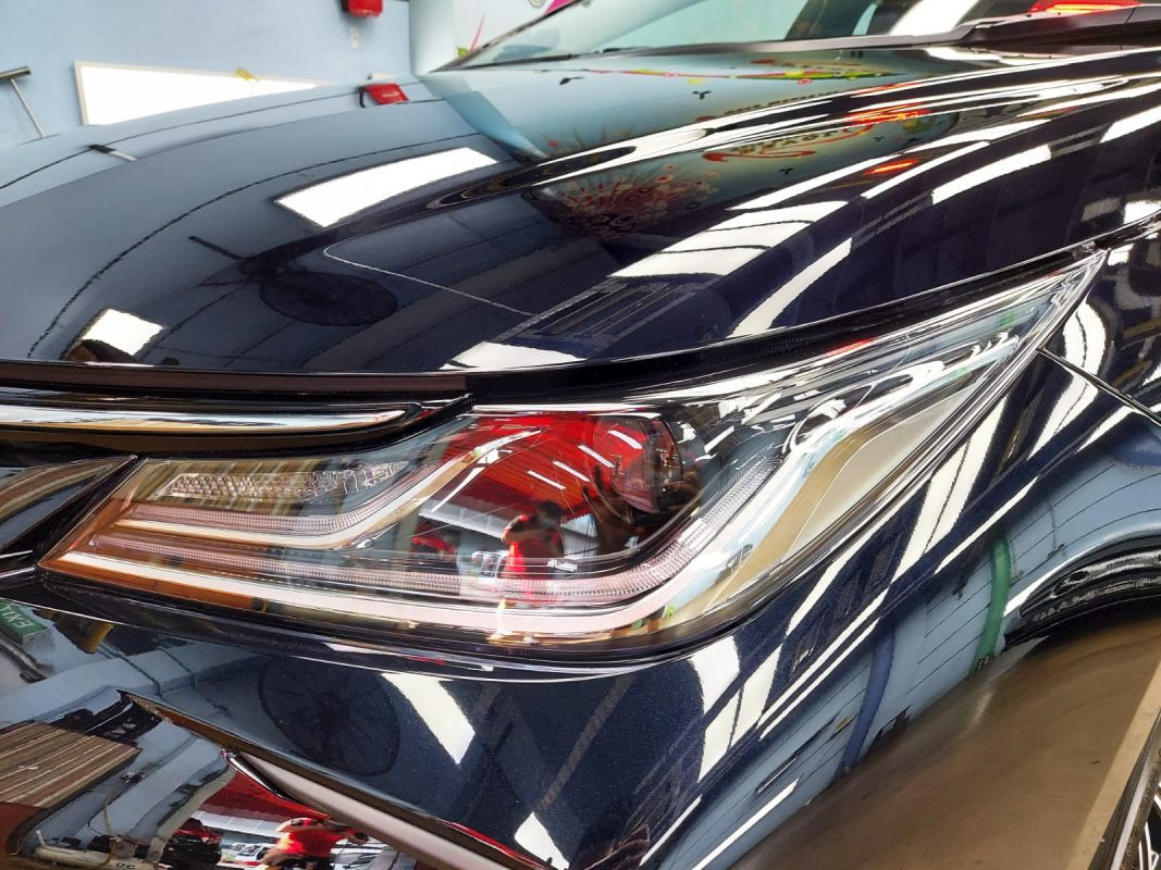 The Altis's coated paintwork showing clean reflections.