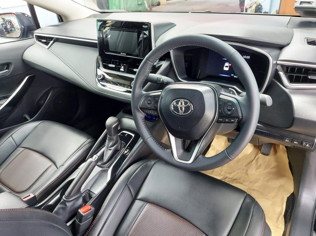 The Toyota Altis parked in the workshop, freshly coated.