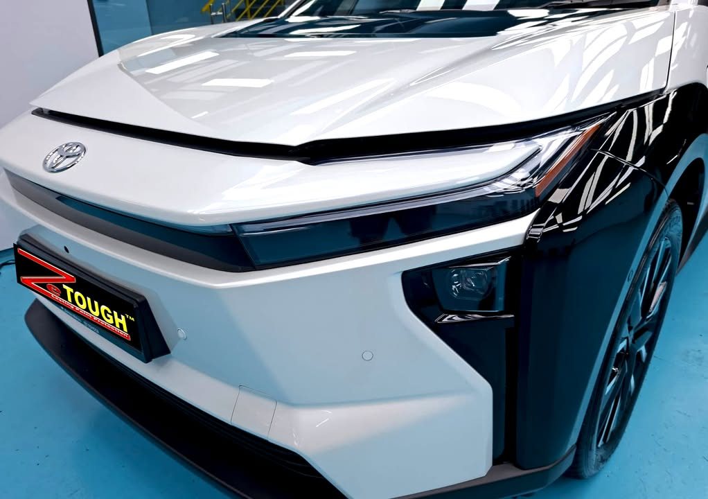 White front bumper and bonnet of the Toyota bZ4X with a ZeTough plate.