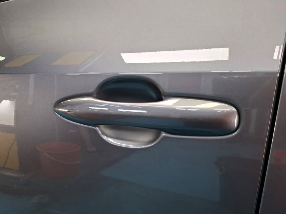 Grey door handle and door panel on the Toyota bZ4X.