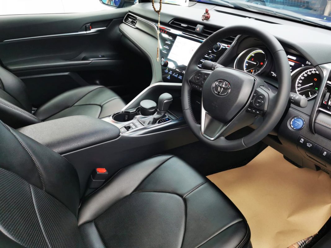 The Toyota Camry Hybrid parked in the workshop, freshly coated.