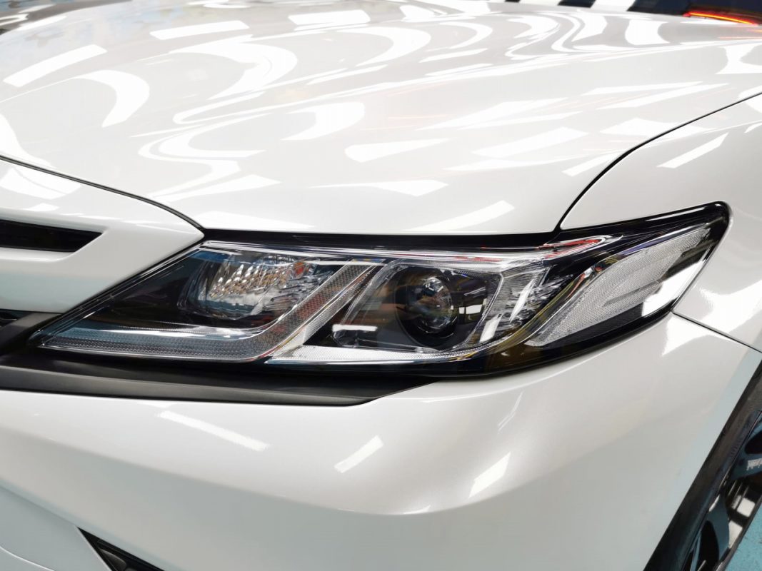 The Camry Hybrid's coated paintwork showing clean reflections.