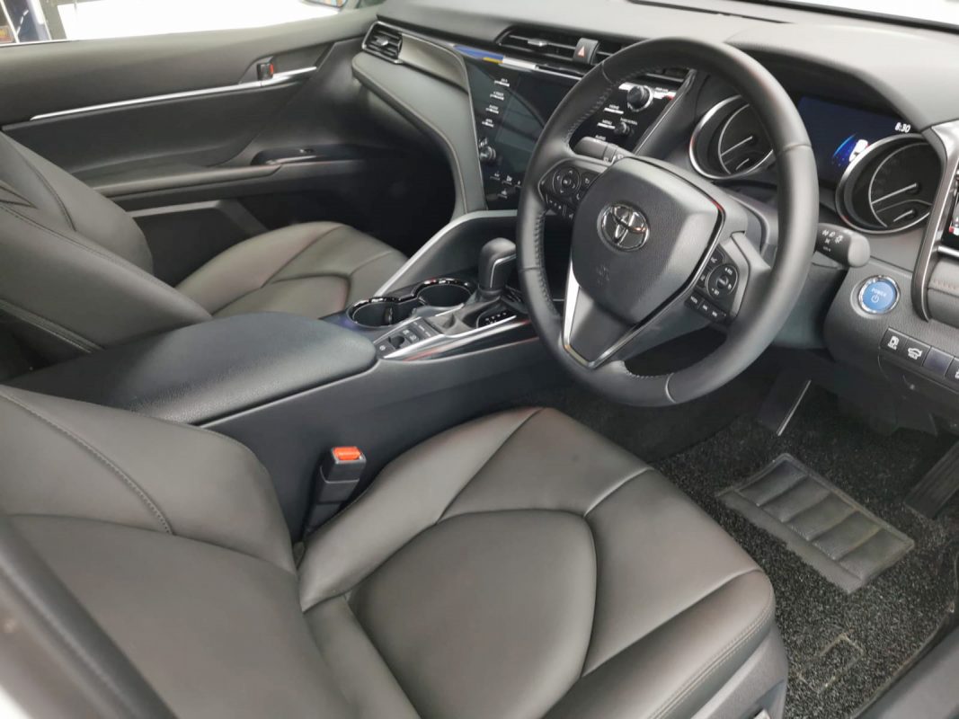 The Toyota Camry Hybrid parked in the workshop, freshly coated.
