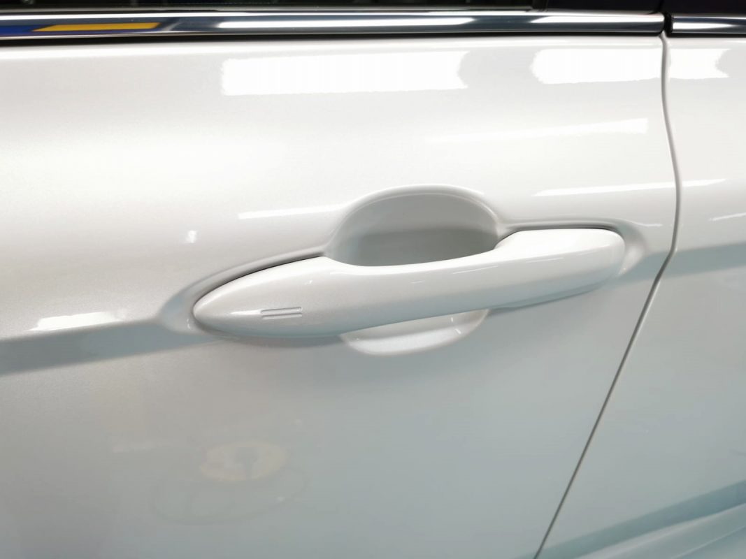Front three-quarter view of the Toyota Camry Hybrid after coating.
