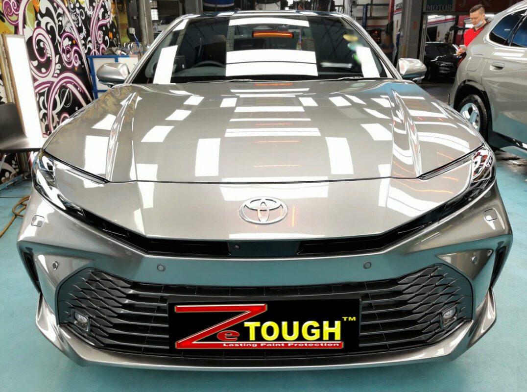 The Toyota Camry from a side angle after the ceramic coating.