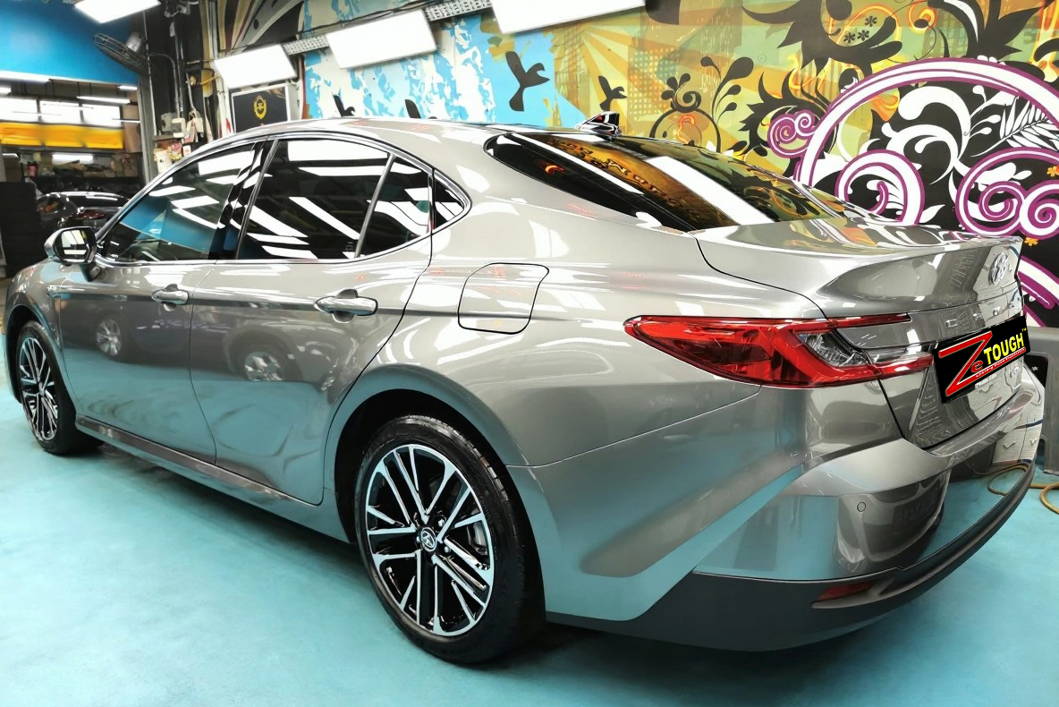 Rear quarter of the Toyota Camry, glossy and protected.