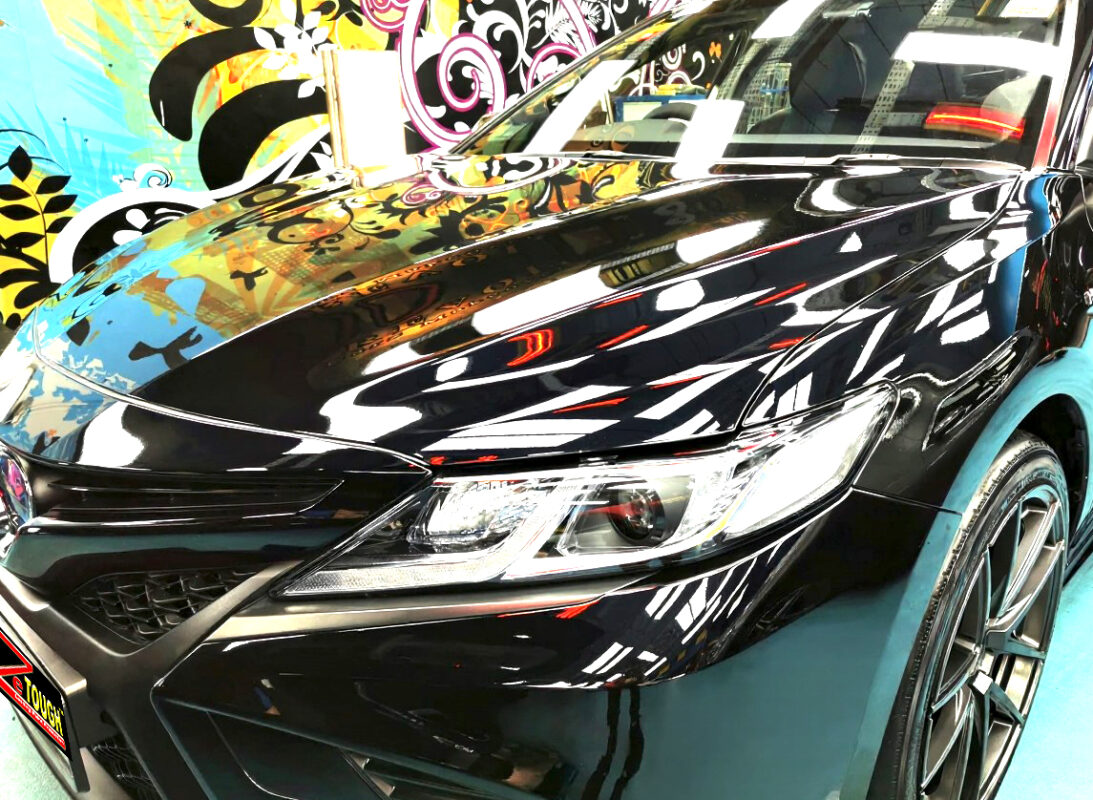 The Toyota Camry from a side angle after the ceramic coating.