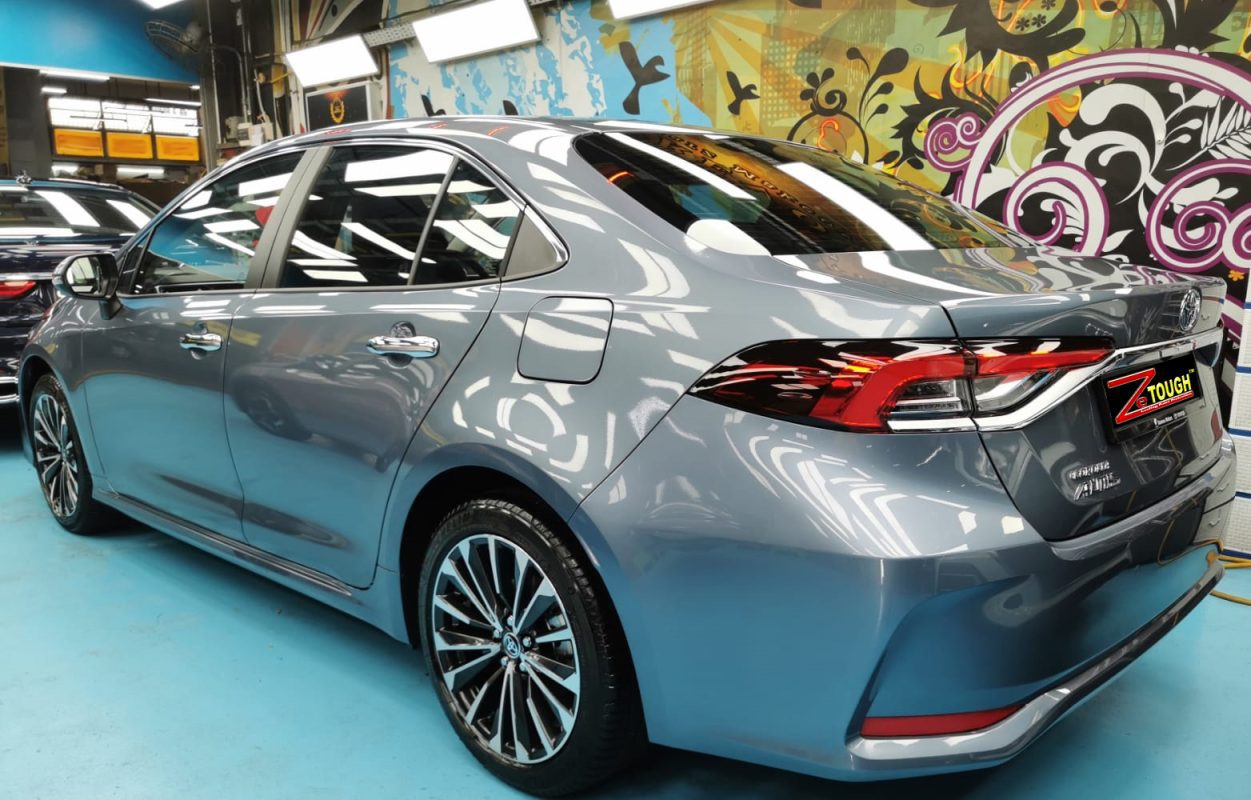 Rear quarter of the Toyota Corolla Altis, glossy and protected.