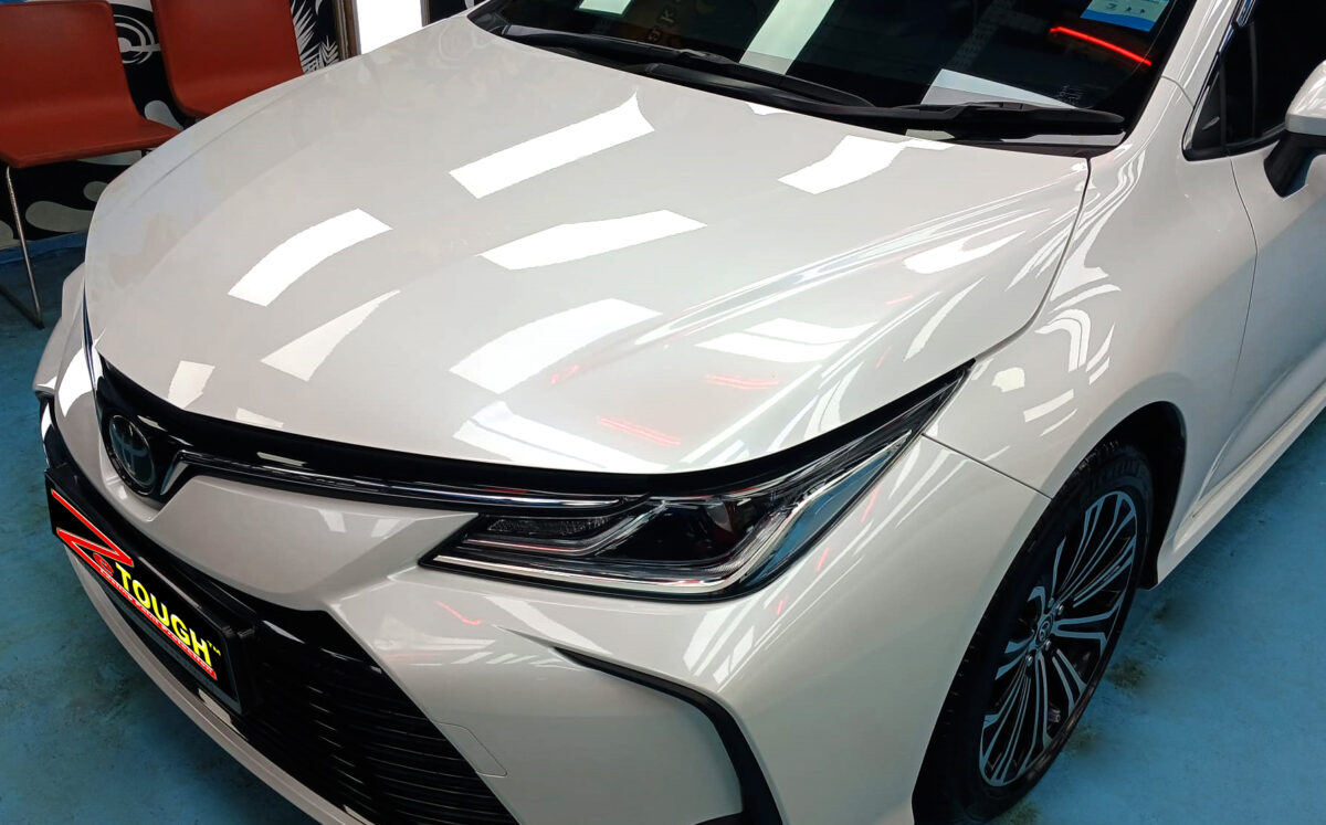 The Toyota Corolla Altis from a side angle after the ceramic coating.