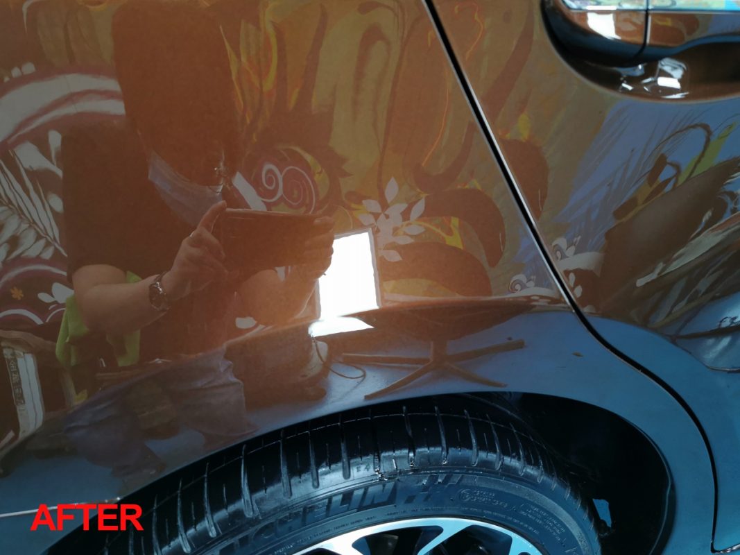 Glossy body panels on the resprayed Corolla Altis.