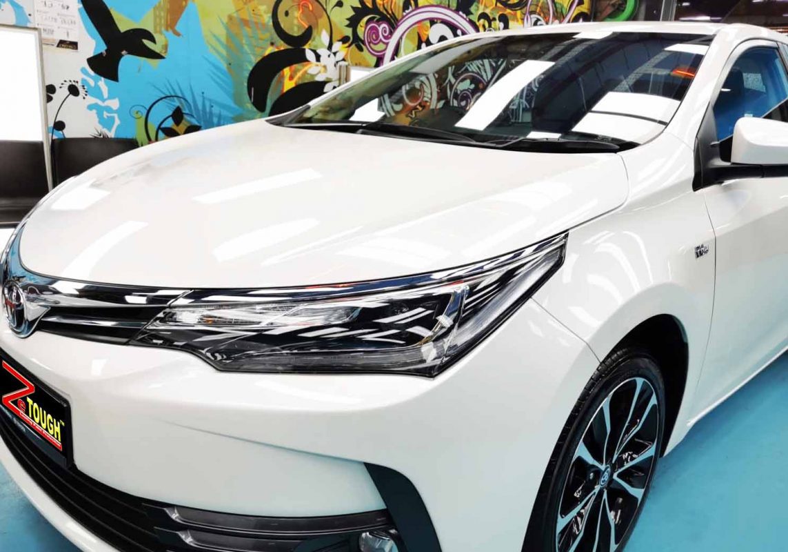 The Toyota Corolla Altis from a side angle after the ceramic coating.