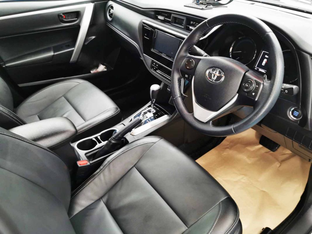 The Toyota Corolla Altis parked in the workshop, freshly coated.