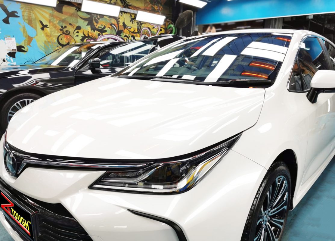 The Toyota Corolla Altis from a side angle after the ceramic coating.