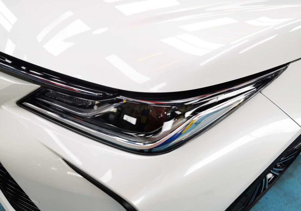 The Corolla Altis's coated paintwork showing clean reflections.