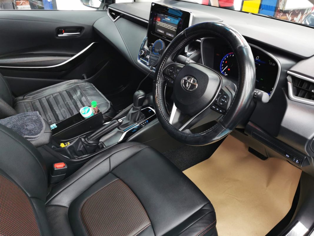 The Toyota Corolla Altis parked in the workshop, freshly coated.