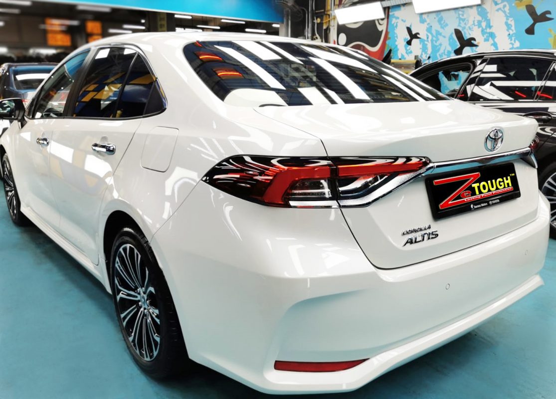 Rear quarter of the Toyota Corolla Altis, glossy and protected.