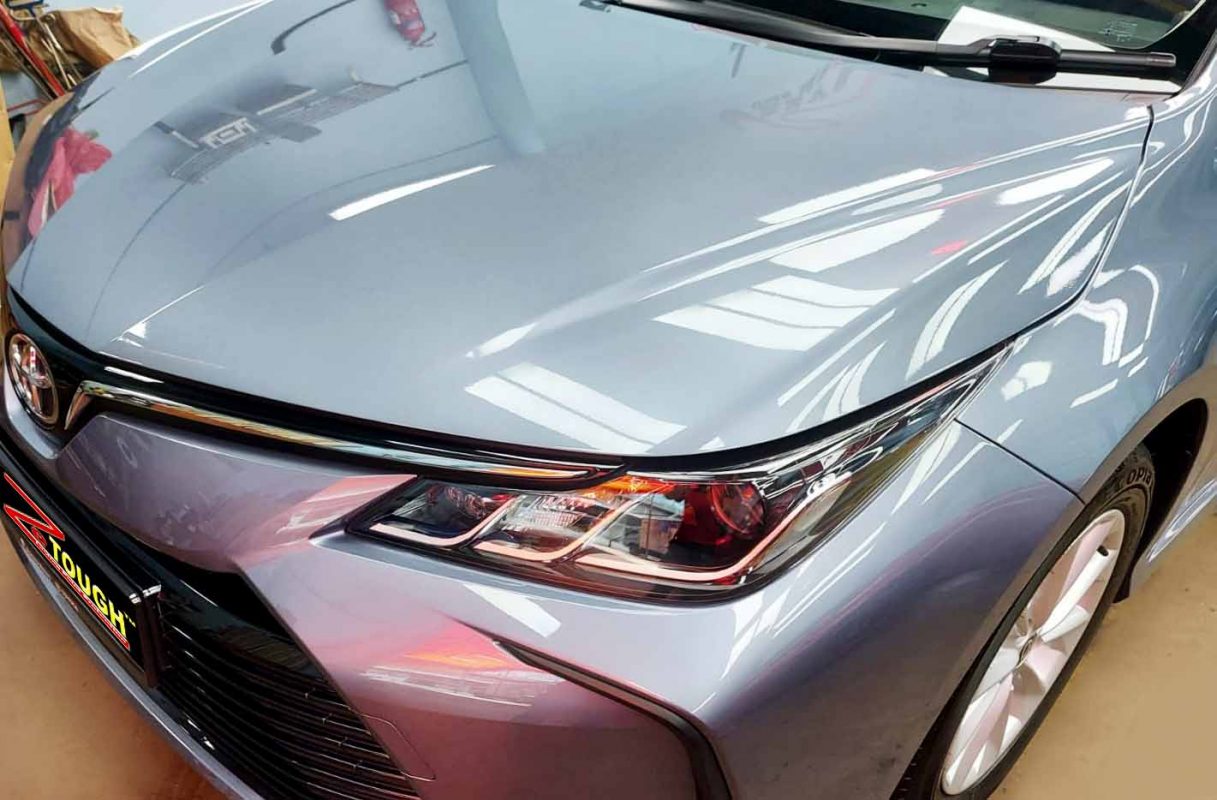 Side view of the Toyota Corolla Altis after the ceramic coating.