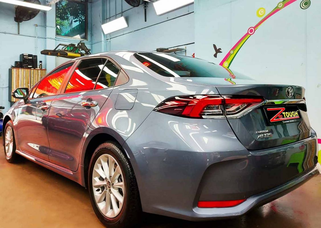 Rear three-quarter view of the coated Corolla Altis.