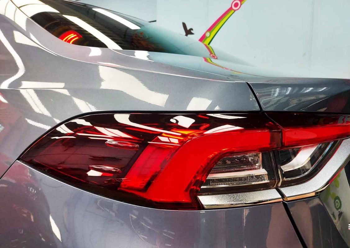 The bonnet of the Corolla Altis under workshop lighting.