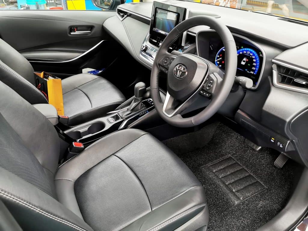 The Toyota Corolla Altis parked in the workshop, freshly coated.