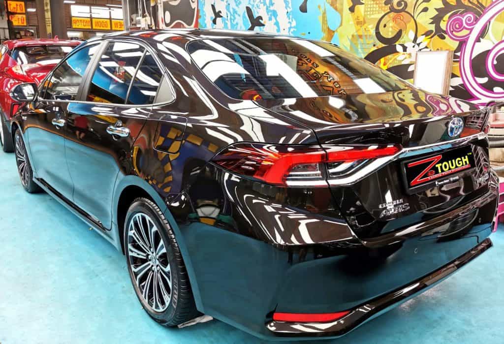 Rear quarter of the Toyota Corolla Altis, glossy and protected.