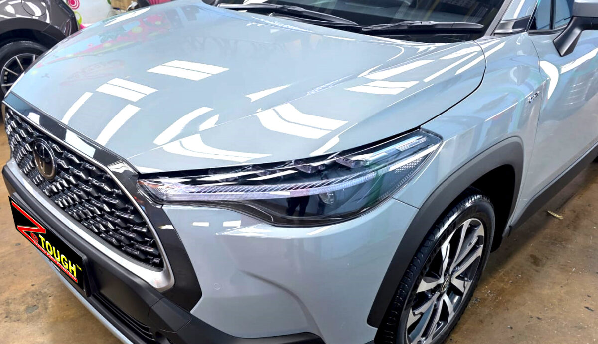 The Toyota Corolla Cross Hybrid from a side angle after the ceramic coating.