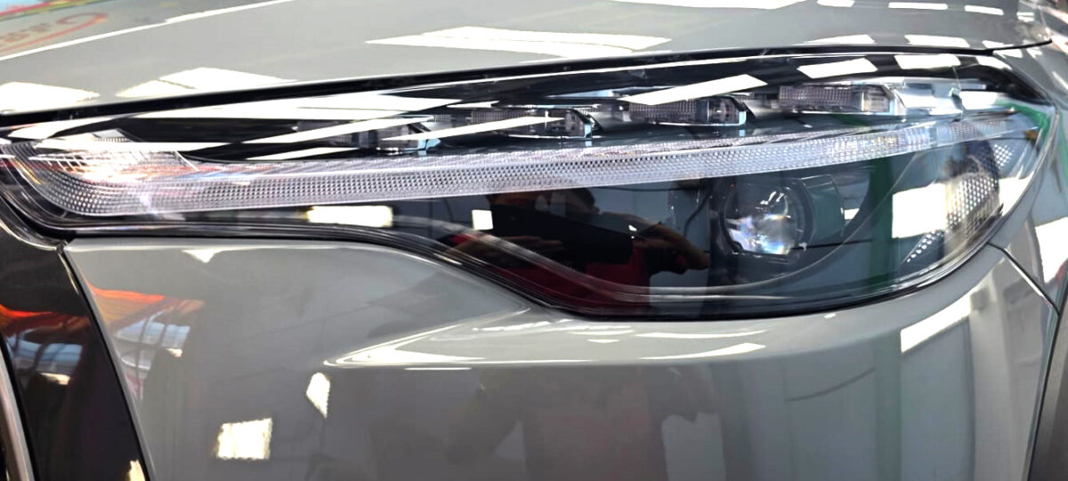 The Corolla Cross's coated paintwork showing clean reflections.