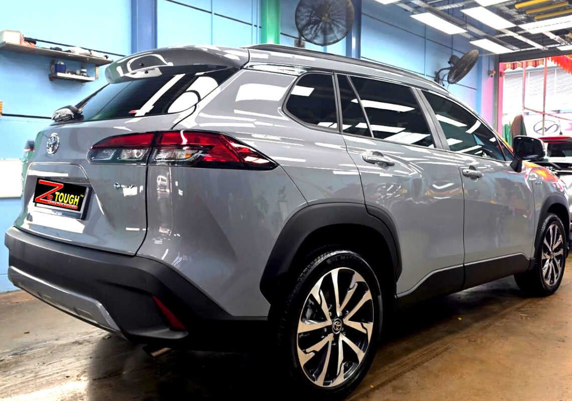 Rear quarter of the Toyota Corolla Cross Hybrid, glossy and protected.