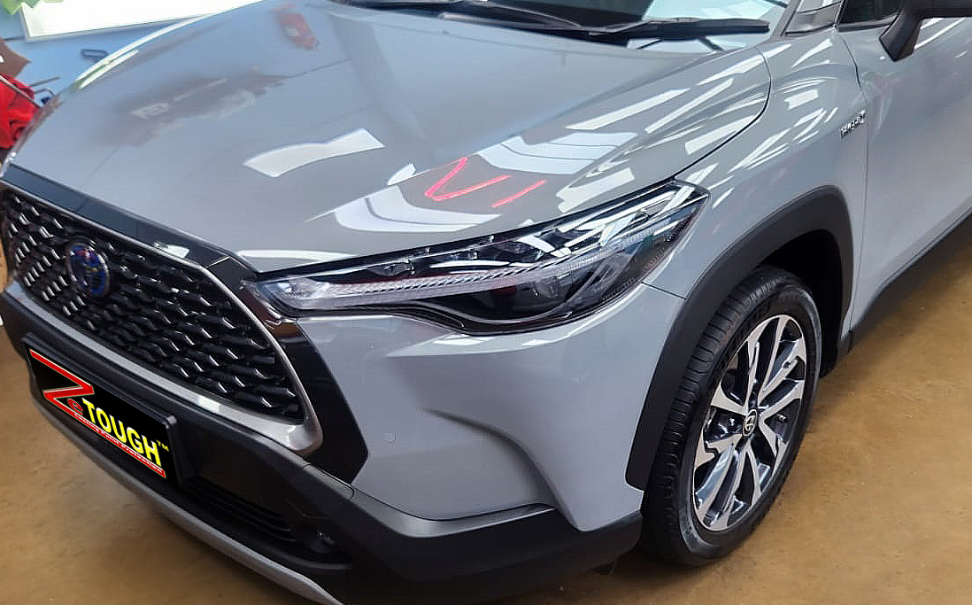 The Toyota Corolla Cross Hybrid from a side angle after the titanium coating.
