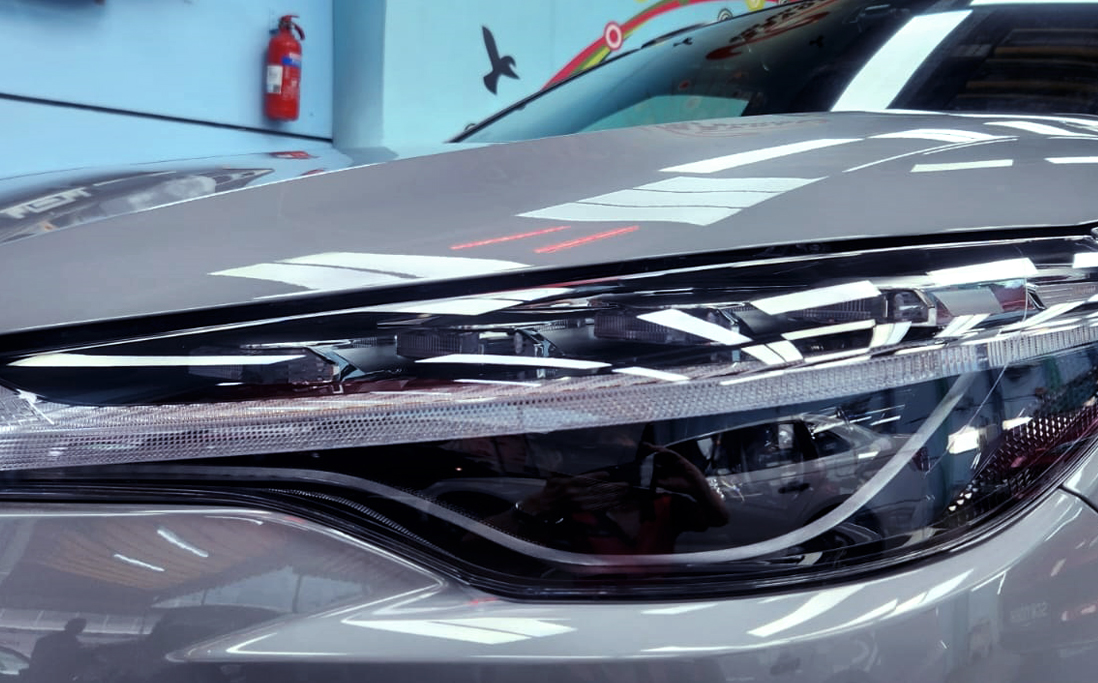 The Corolla Cross's coated paintwork showing clean reflections.