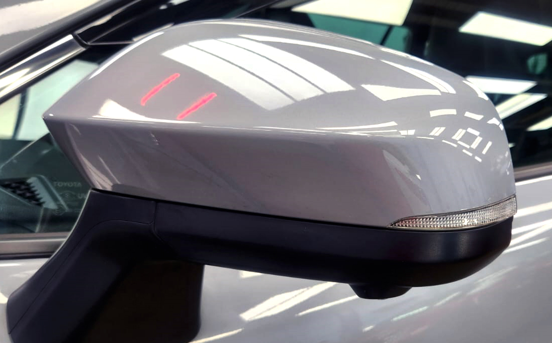 Side panel of the Toyota Corolla Cross Hybrid with the titanium finish locked in.
