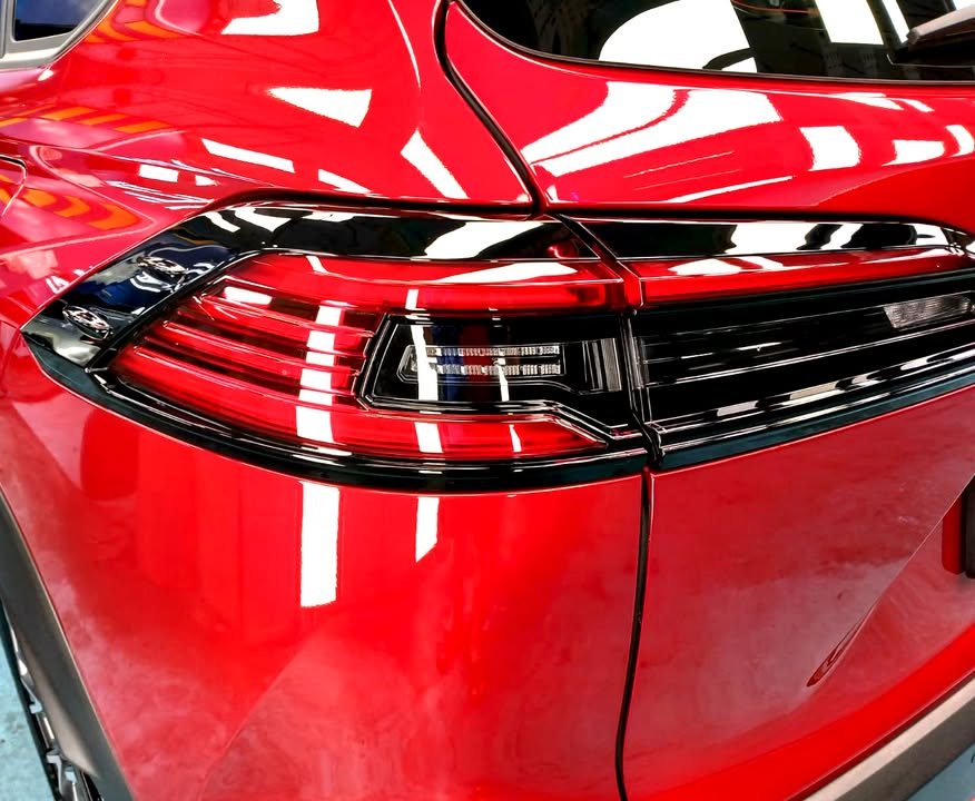 Red rear quarter panel and tail light.