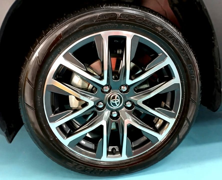 Two-tone alloy wheel with a Toyota centre cap.