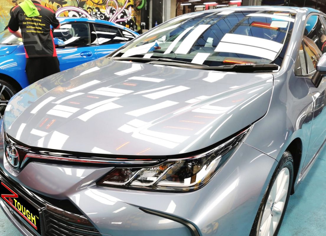 The Toyota Corolla from a side angle after the ceramic coating.