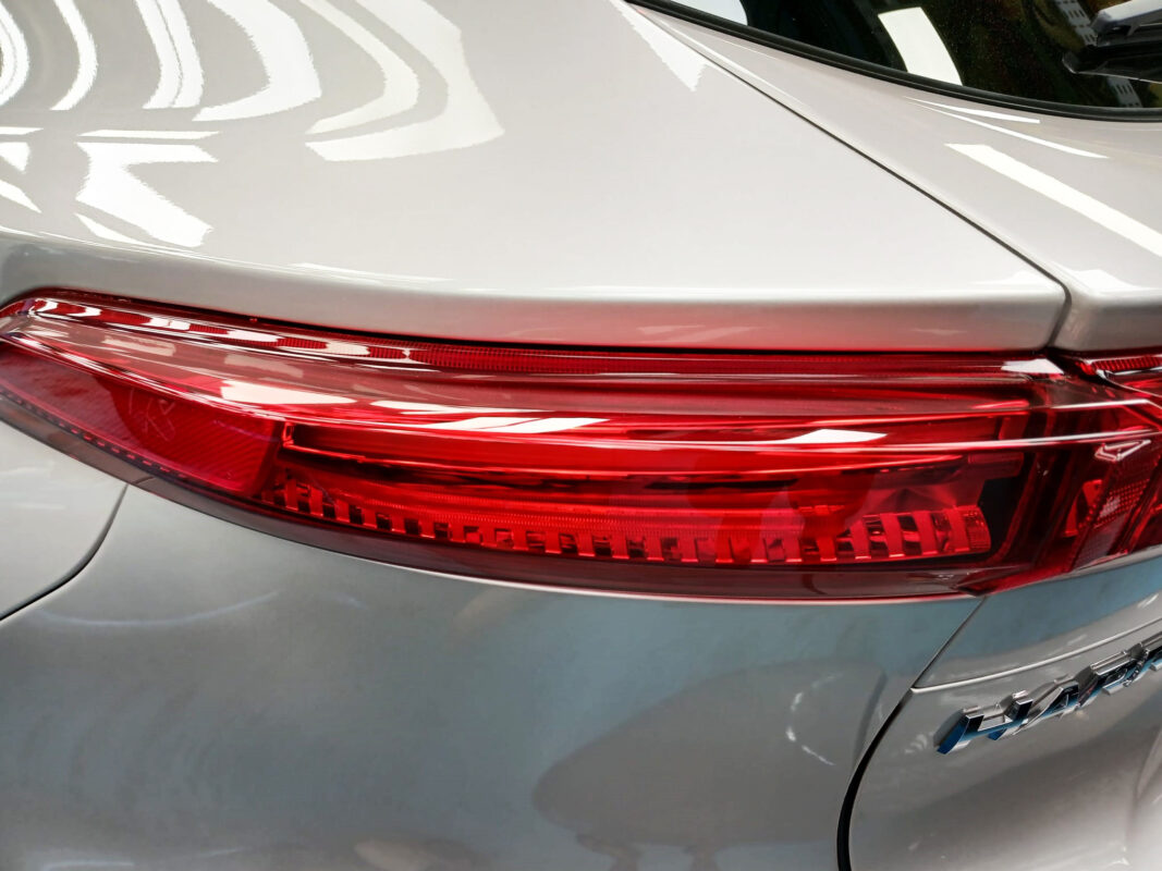 The coated bonnet of the Toyota Harrier under workshop lighting.