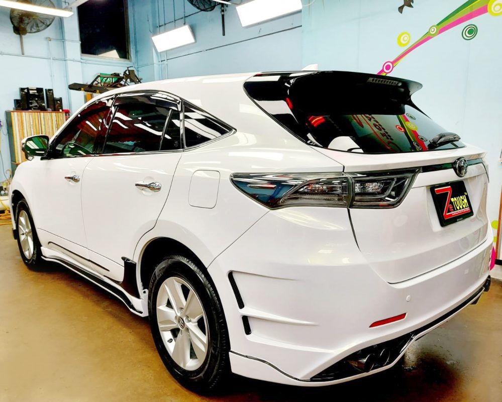 Rear quarter of the Toyota Harrier Elegance, glossy and protected.
