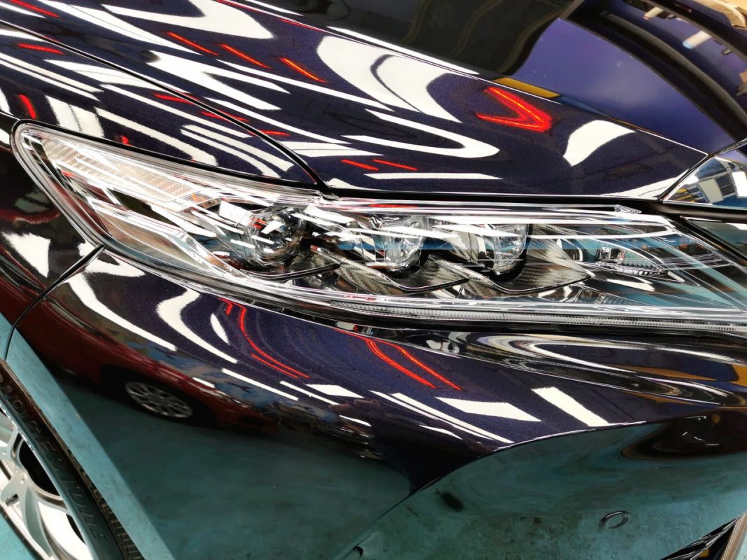 The Harrier's coated paintwork showing clean reflections.