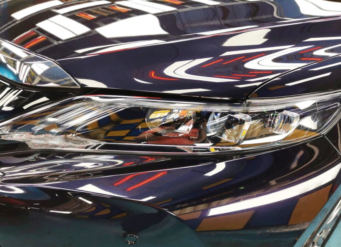 The Harrier's coated paintwork showing clean reflections.