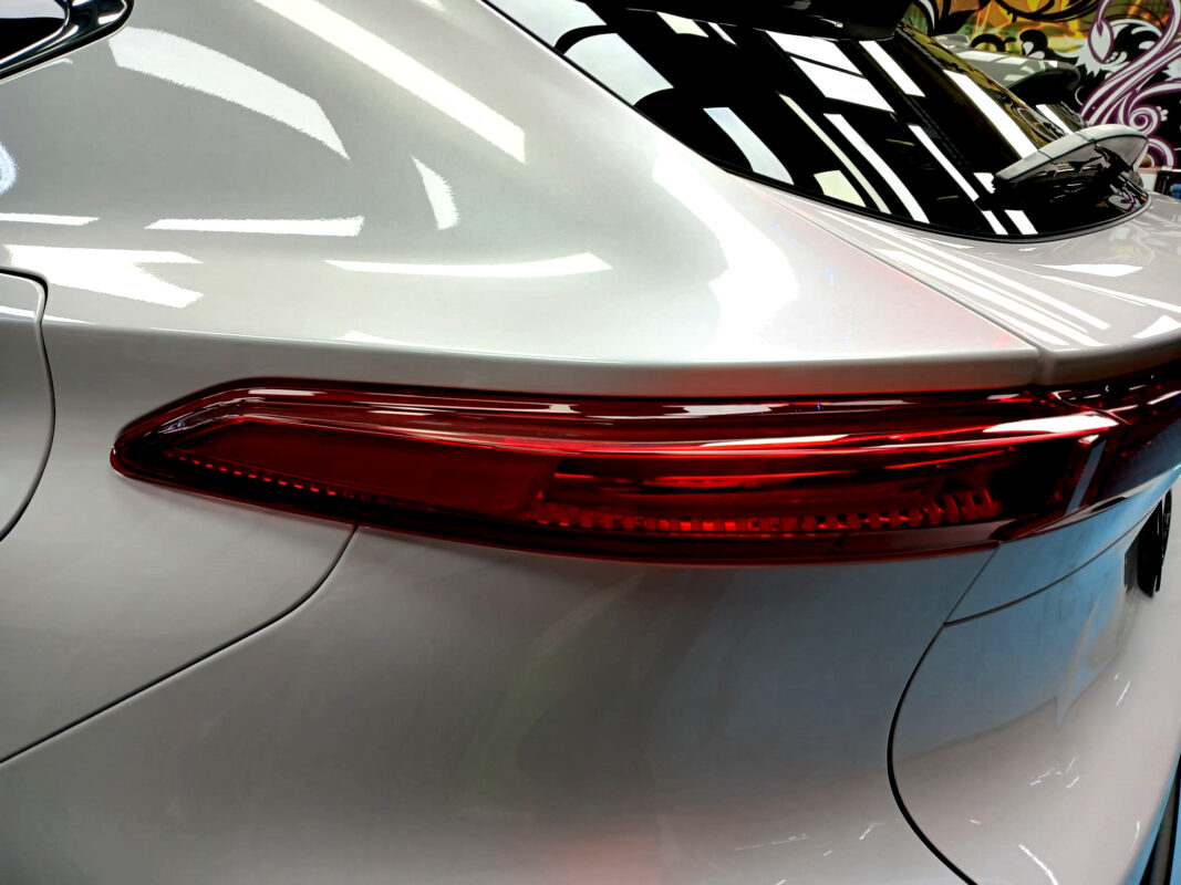 The coated bonnet of the Toyota Harrier under workshop lighting.