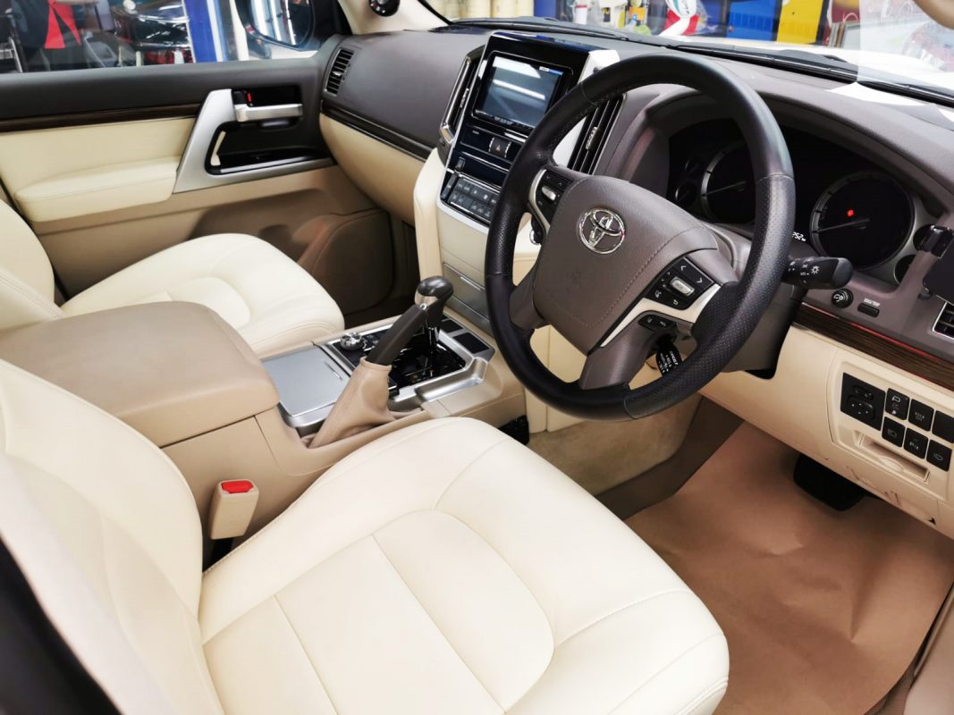 The Toyota Land Cruiser parked in the workshop, freshly coated.