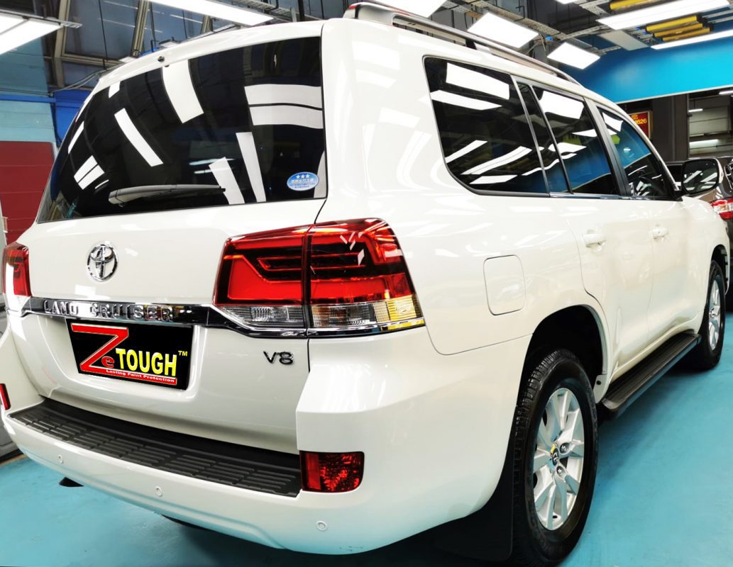 Rear quarter of the Toyota Land Cruiser, glossy and protected.