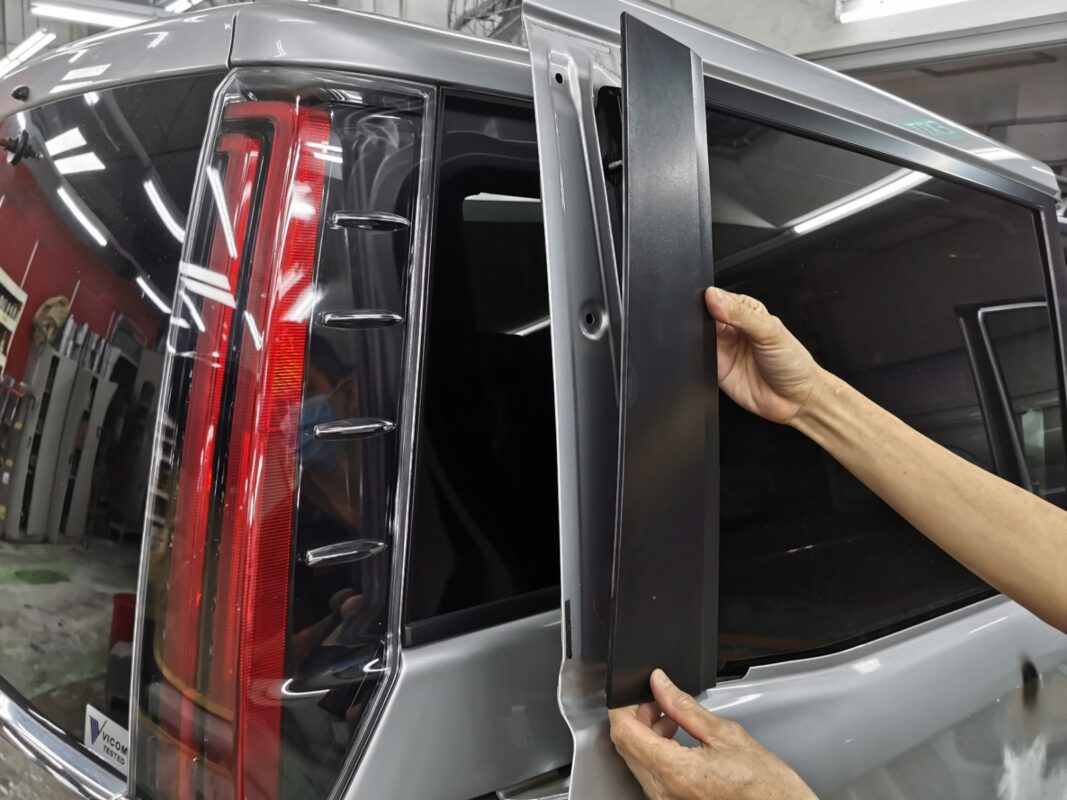 The Toyota Noah at Revol Carz as strip-down begins, front three-quarter view.