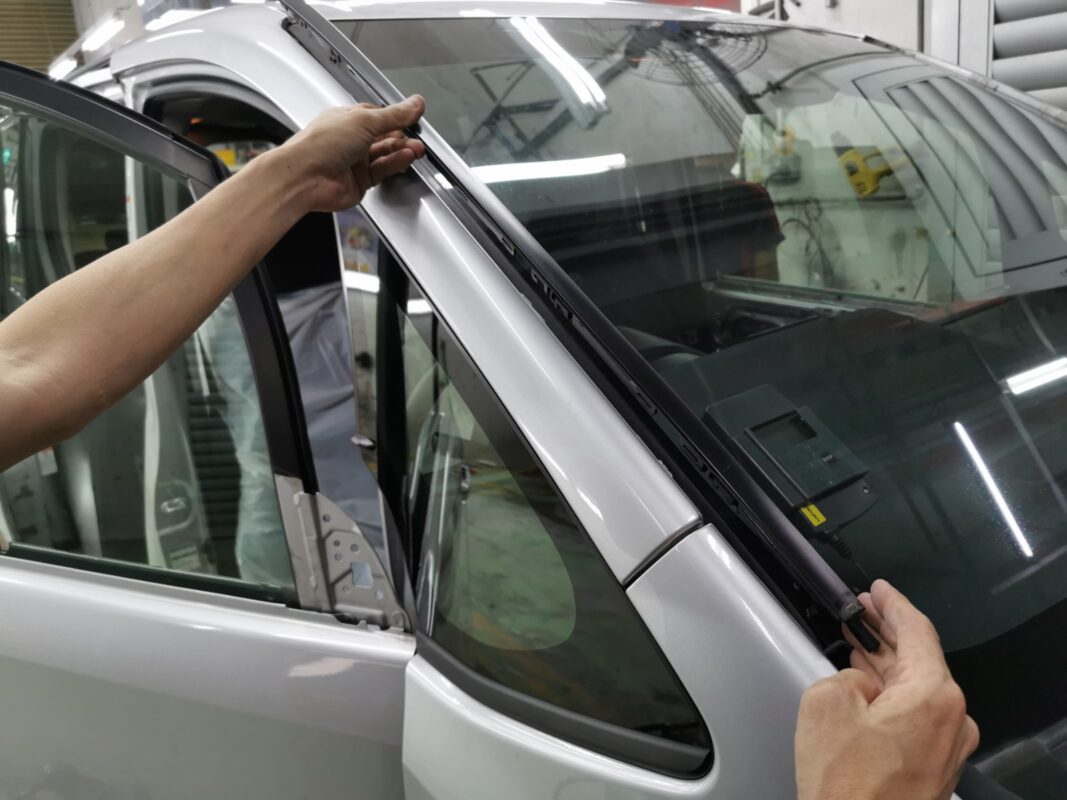 Panels and trim being removed from the Toyota Noah during strip-down.