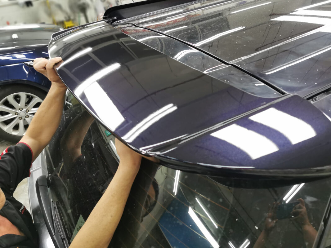 The freshly painted Toyota Previa Aeras, panels laid with the new colour.