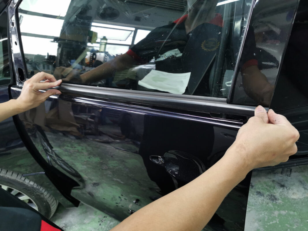 Reassembly in progress on the Toyota Previa Aeras after painting and polishing.