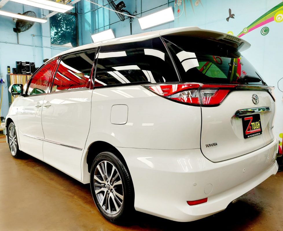 Rear quarter of the Toyota Previa Aeras, glossy and protected.