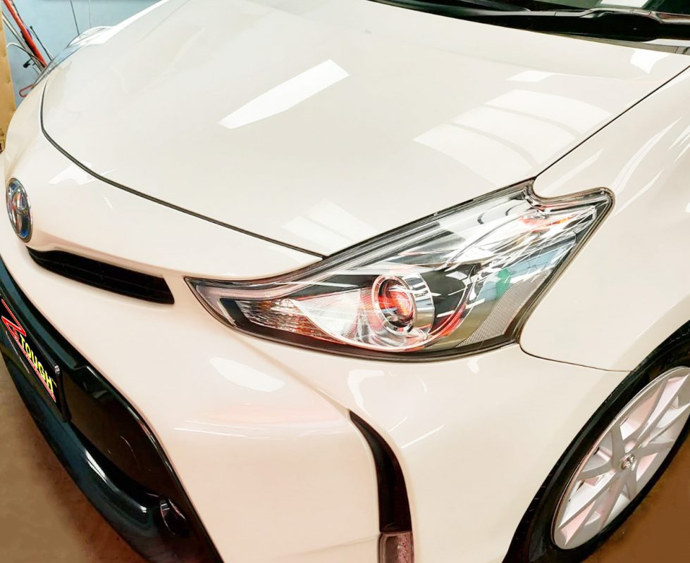 The Toyota Prius Plus from a side angle after the titanium coating.
