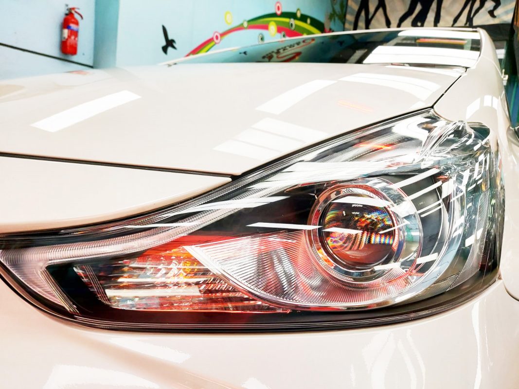 The Prius Plus's coated paintwork showing clean reflections.