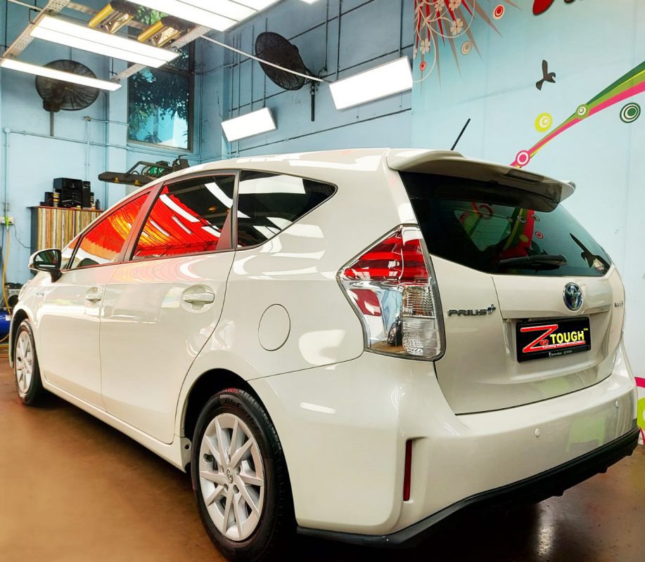 Rear quarter of the Prius Plus, glossy and protected.