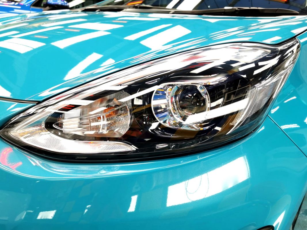 The Prius's coated paintwork showing clean reflections.